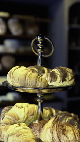 freshly baked pastries displayed in a cozy bakery at night