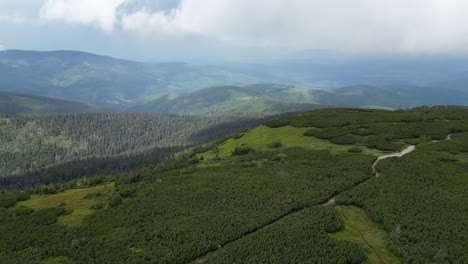 Aerial-view-trail-in-of-Beskid-mountains-durring-cloudy-day---drone-4K