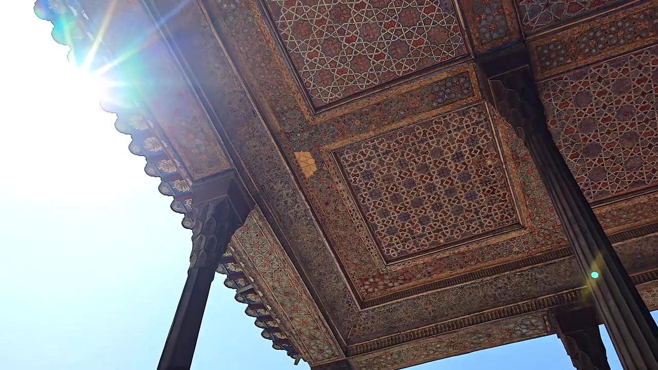 Intricate Persian Ceiling Architecture with Sun Flare