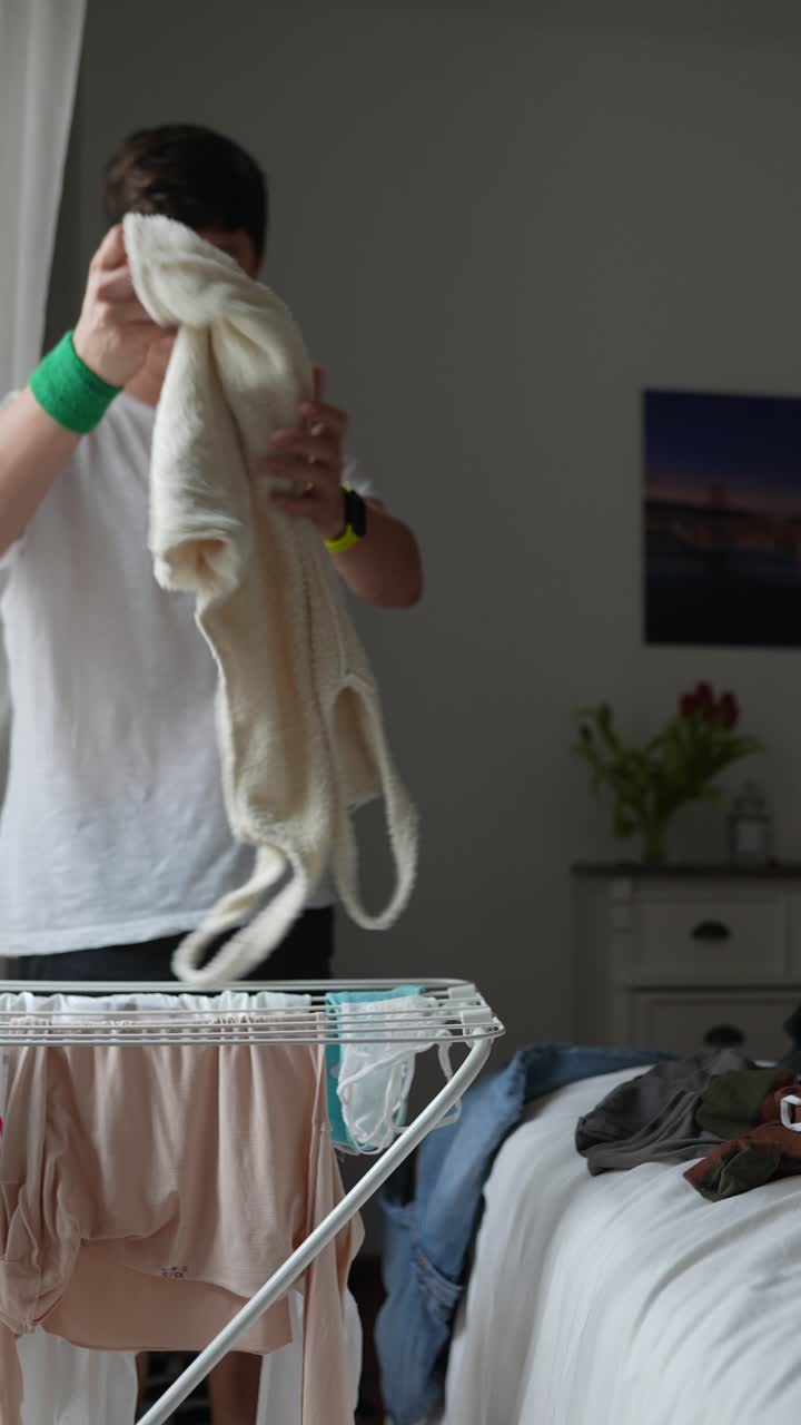 Person Drying Clothes