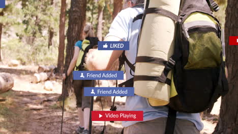 mature couple hiking forest trail, overlaying floating social media notification graphics