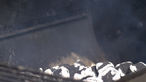 charcoal burning and fire in slow motion in an offset smoker bbq pit