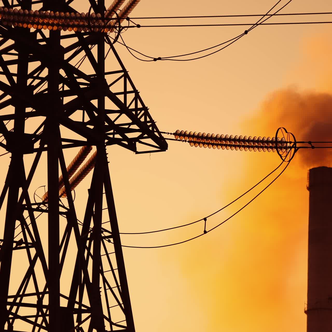 High voltage electric pole. View footage of high voltage electricity tower at sunset