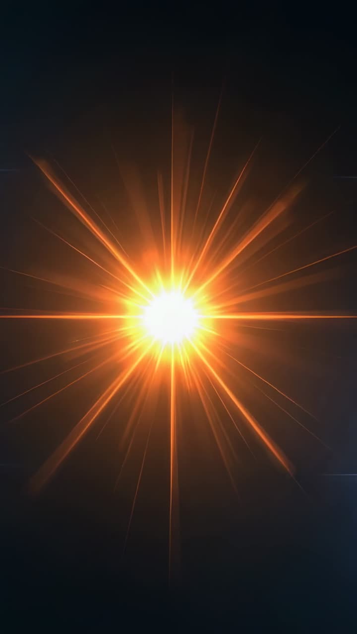 Vertical video: Emerging glow sparking starburst pulsing fading on dark backdrop, lens flare effect