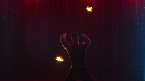 fire dancer in the rain