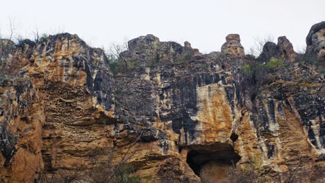 a weathered limestone slope unveils its rugged textures and jagged edges — a striking display of geological beauty carved by time and the elements.