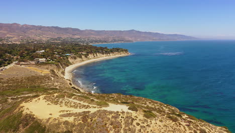 aerial drone shot of the famous point dume state beach in malibu, california on a sunny summer day