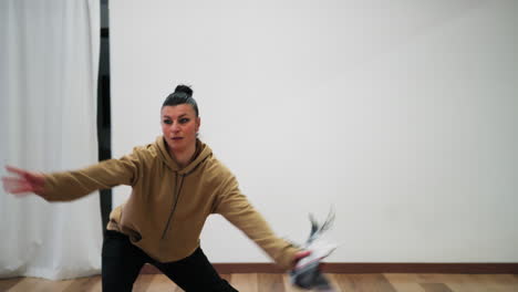 woman metaphorically frees herself from problems by dancing in the hall