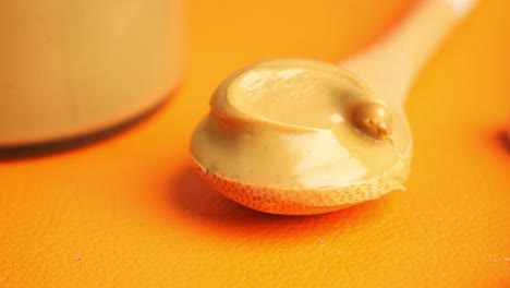 pistachio butter on a wooden spoon