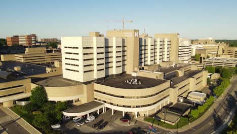 modern hospital building in michigan, aerial ascend view