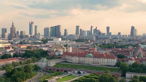 Aerial-panorama-of-Warsaw,-Poland-over-the-Vistual-river-and-City-center-in-a-distance