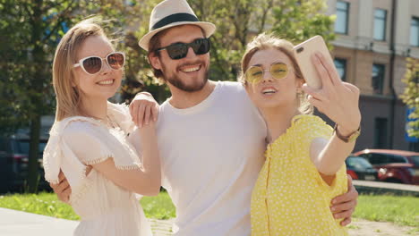 friends taking a selfie outdoors