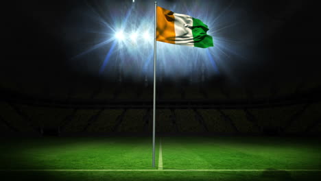 ivory coast national flag waving on flagpole