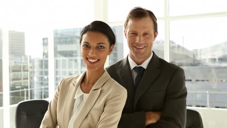 Confident-business-team-standing-in-office