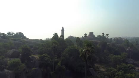 Light-house-of-mamallapuram-situated-among-famous-Rock-cut-Pallava-era-temples,-aerial-view-shot-on-Phantom-4-pro-4K-drone