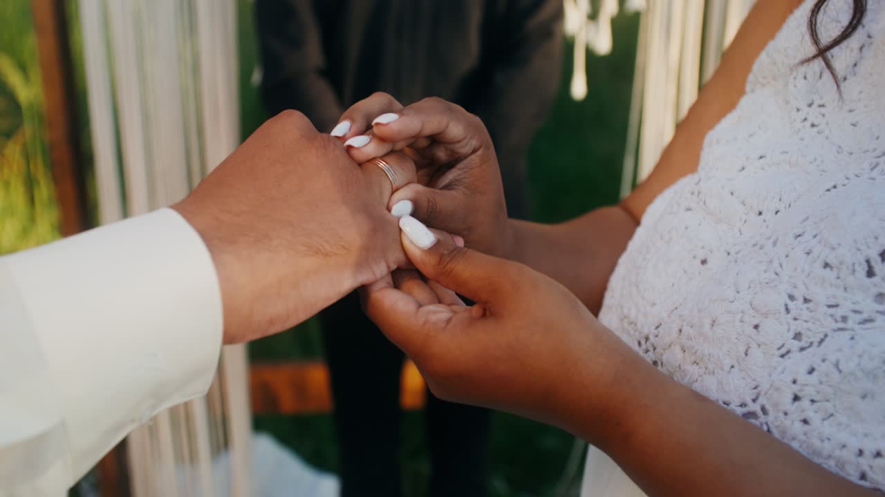Couple exchanging rings during a wedding ceremony