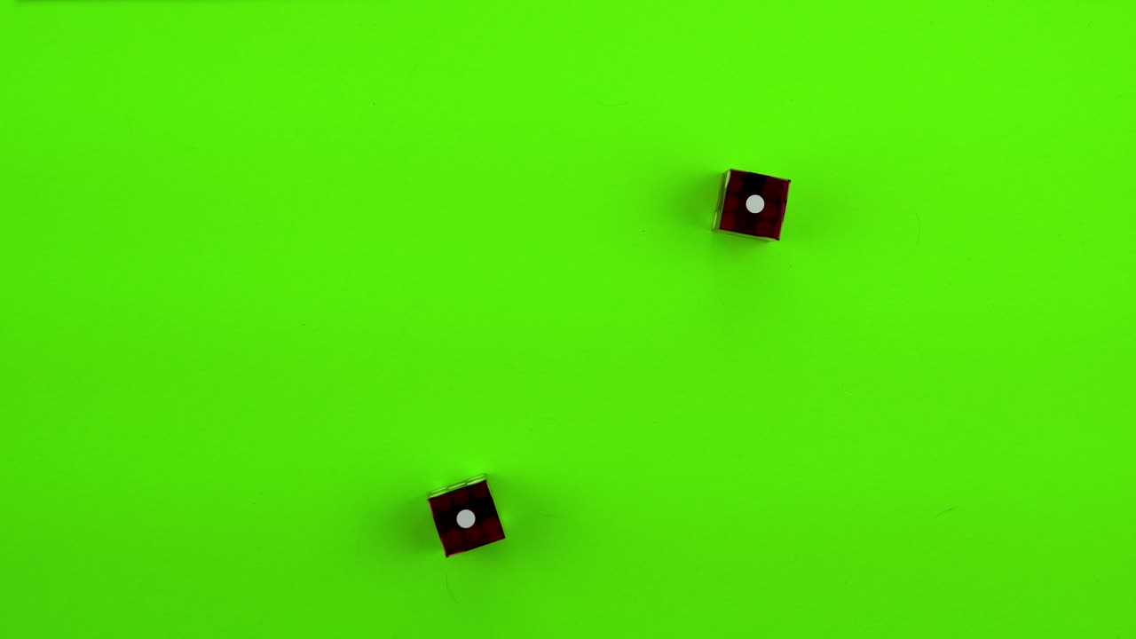 Red Dice rolling craps (double ones) on green screen