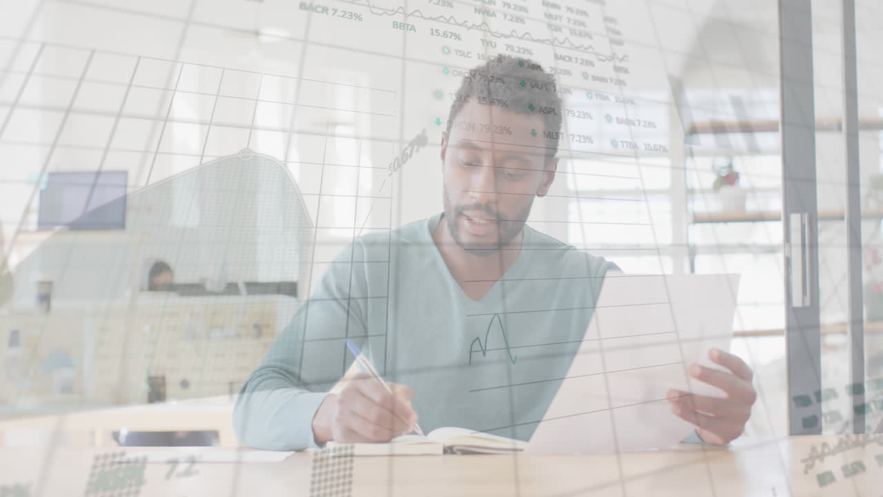 Animation of graphs, trading board, biracial man writing in notepad, talking while looking at camera