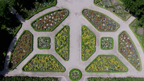 outdoor walkway path in beautiful flower garden landscape - aerial