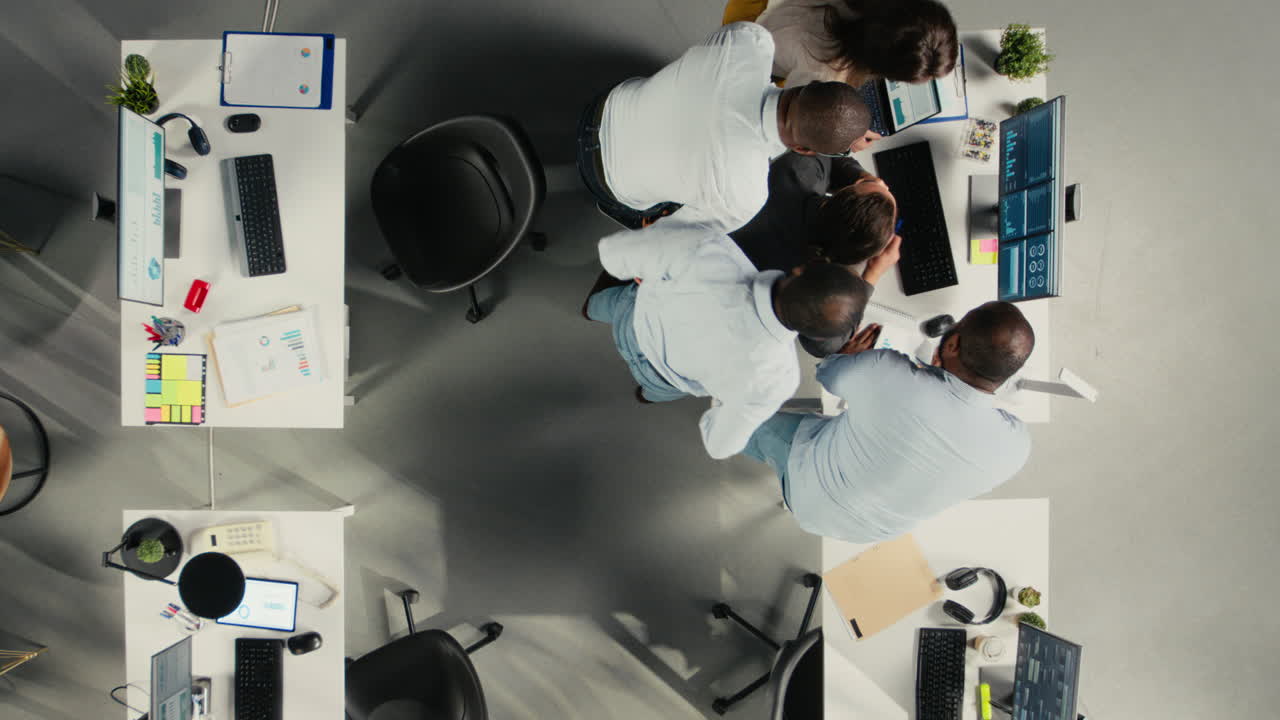 Vertical Video Top down view zoom in of workers in multinational company discuss business
