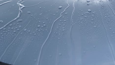 water drops rolling off car