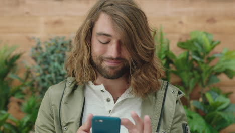 portrait of relaxed young caucasian man texting browsing using smartphone social media app enjoying mobile technology