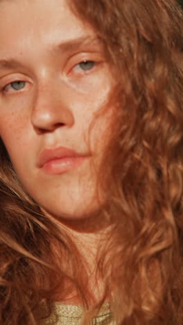 close-up portrait of a young woman with curly hair