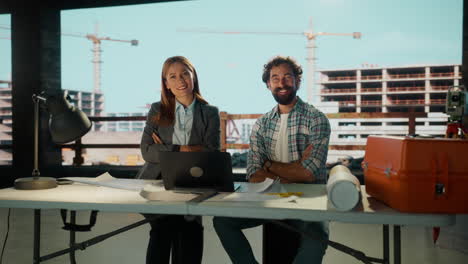 professional engineers and architects collaborating at a construction site