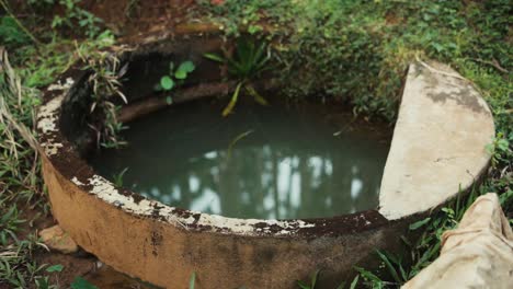 High-angle-gimbal-shot-of-well-water-on-farm