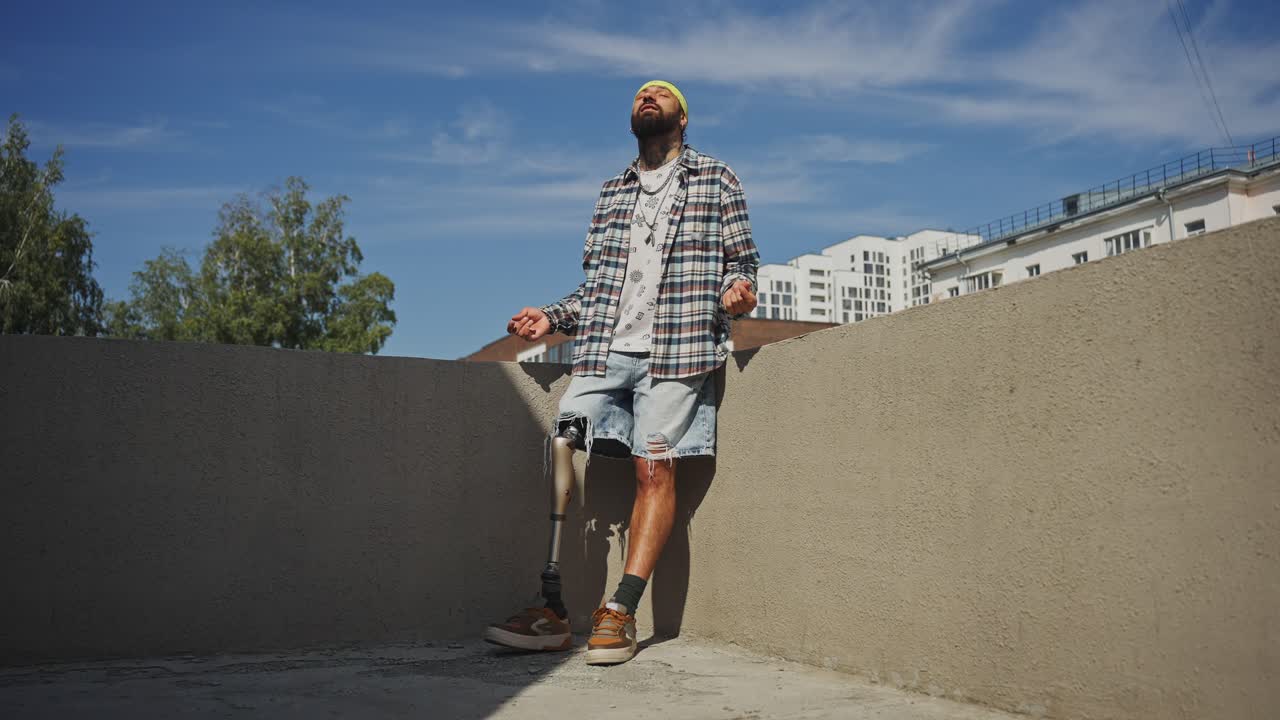 Man with Prosthetic Leg on Rooftop