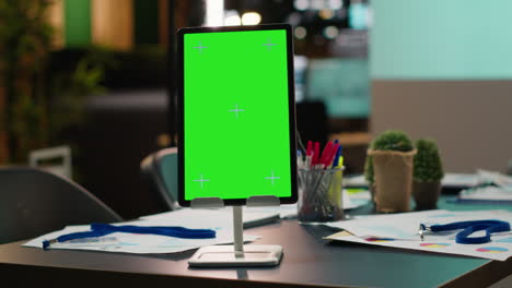 modern empty boardroom with copy space on tablet and data charts on projections