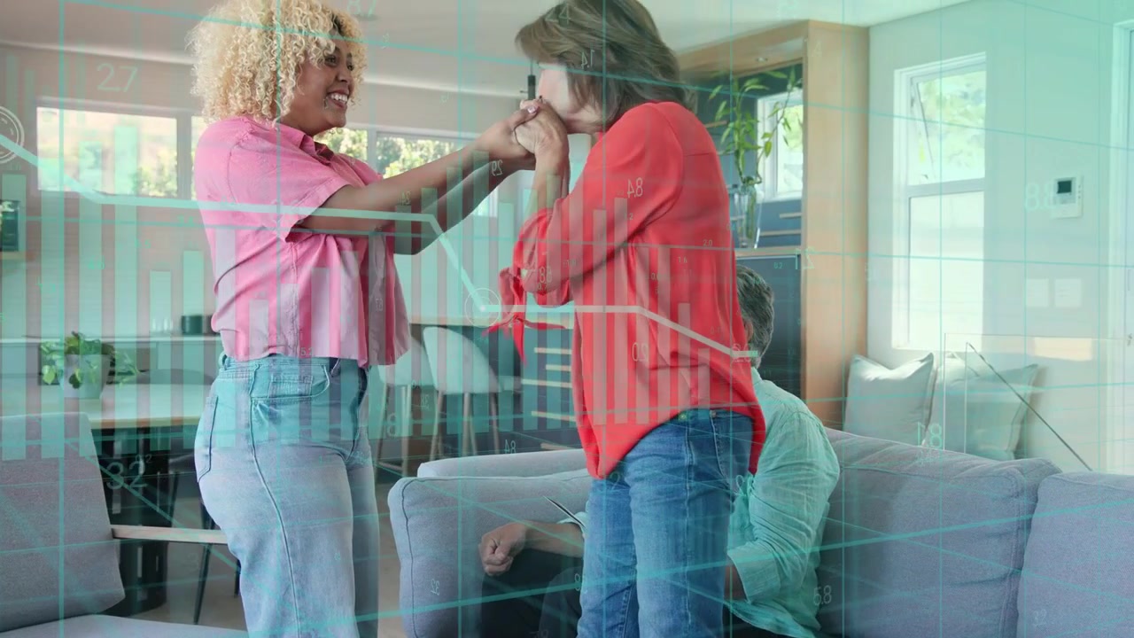 Senior starting hug, two women hugging, holding hands, reunion, charts over home ads, man observing