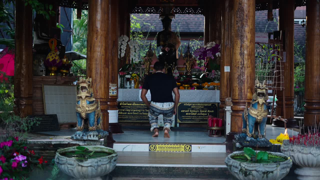 A Person Praying at a Thai Temple