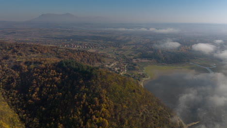 aerial view of mountain landscape with fog and valley