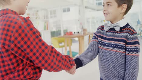 kids as business executives shaking hands, 4k