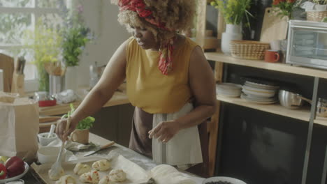woman baking pastries in a home kitchen
