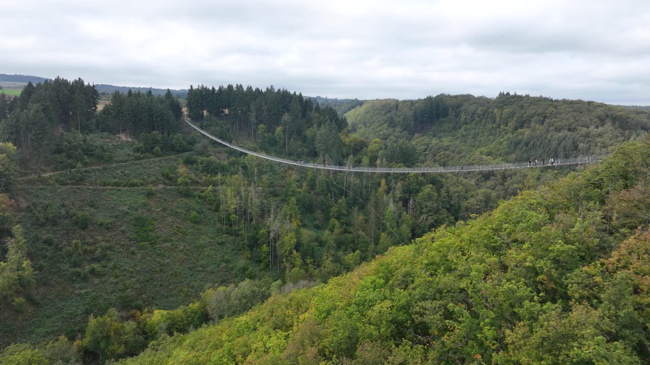 Aerial drone video of The Geierlay Suspension Bridge, pedestrians bridge, spans the Morsdorfer Bachtal. Adventure destination.