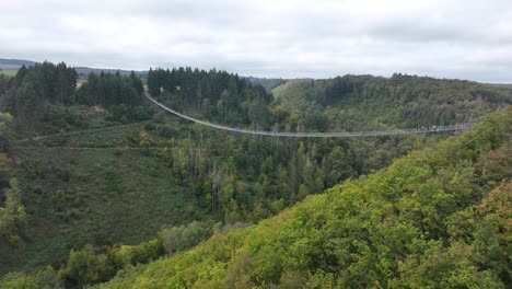 aerial drone video of the geierlay suspension bridge, pedestrians bridge, spans the morsdorfer bachtal. adventure destination.