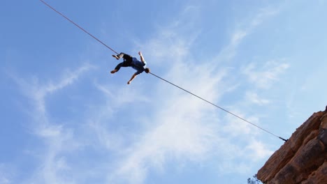 Man-relaxing-on-tight-rope-4k