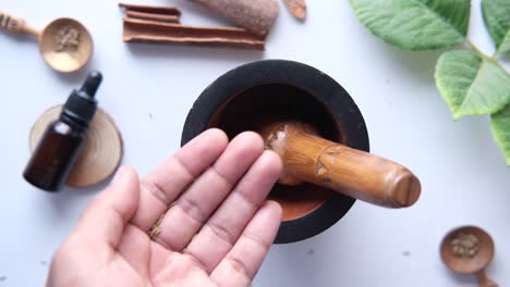 preparing herbal remedies with mortar and pestle