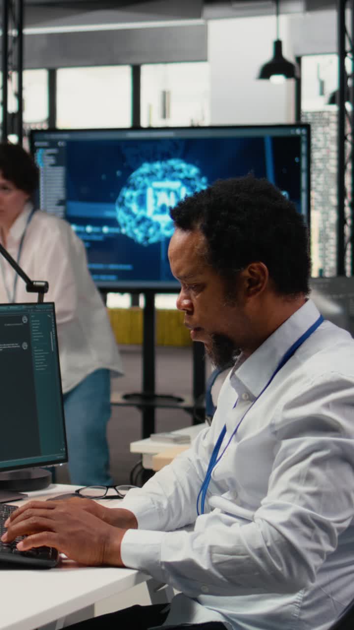 Vertical video Technician in office solving tasks with artificial intelligence LLM chatbot