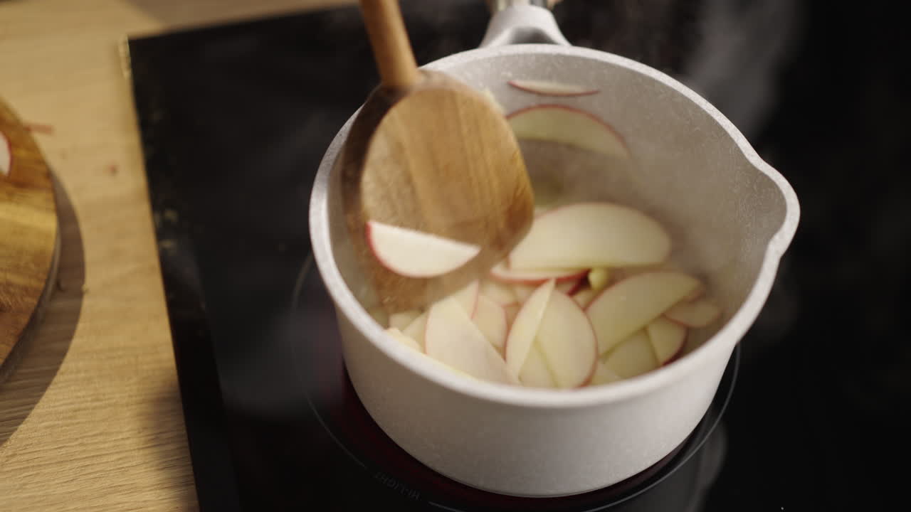 Apple cooking in saucepan