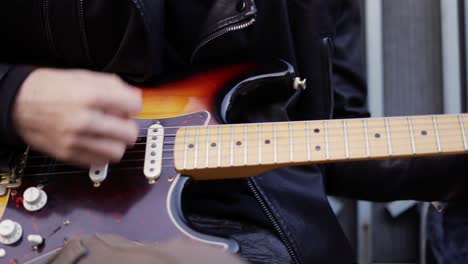 man playing the melody on the giutar