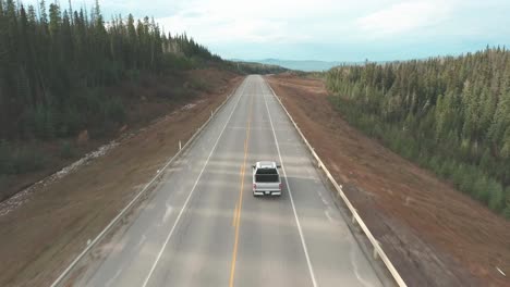 white truck driving on a scenic highway
