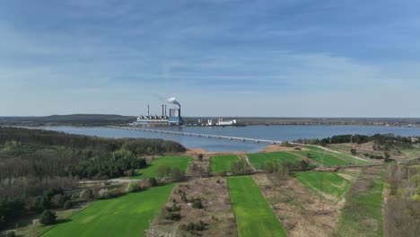 konin power plant aerial view drone approaching the smokey chimney zero emission concept