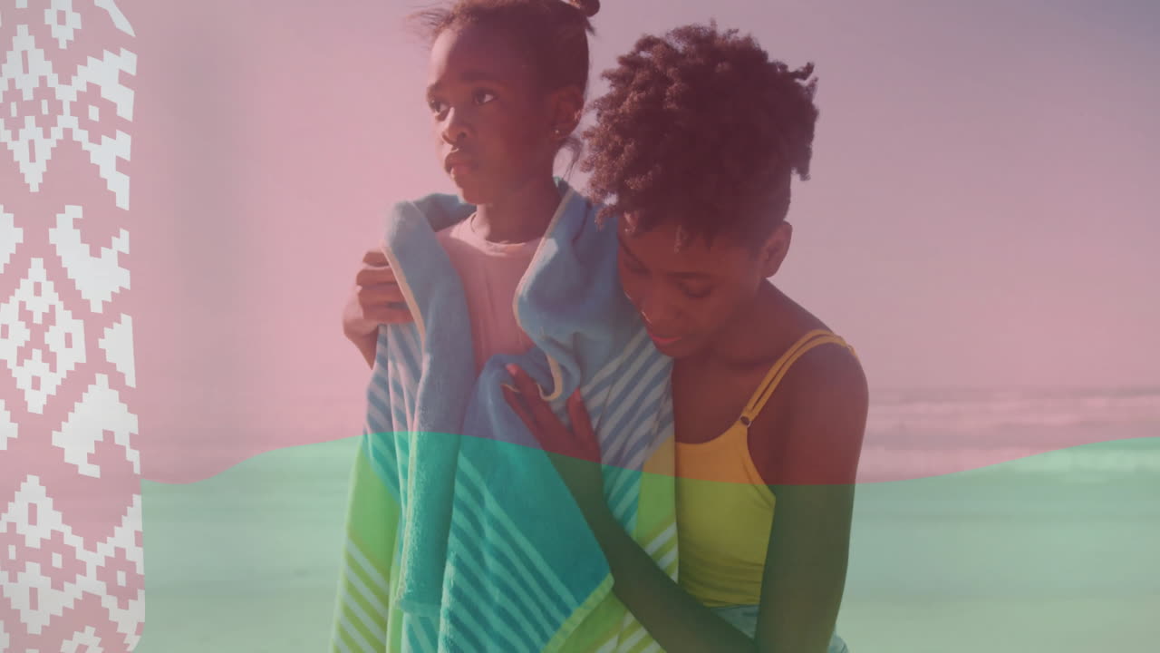 madre envolviendo a su hijo en una toalla en la playa sobre la animación de la bandera de bielorrusia