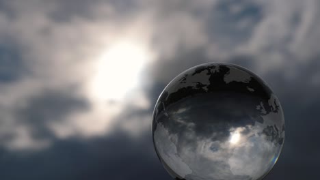 glass earth with a dramatic cloud background.