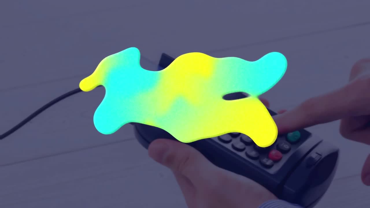animación de una mancha colorida sobre el terminal de pago