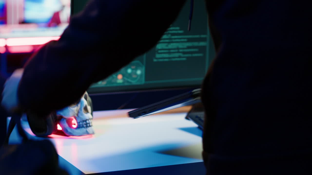 Cybercriminal opening notebook to exploit network backdoors, close up