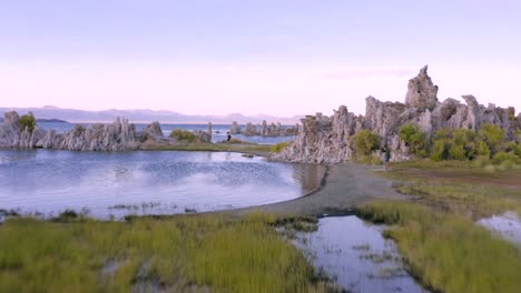 4K-Aerial-of-Tufa-Rocks-in-Mono-Lake,-at-sunset